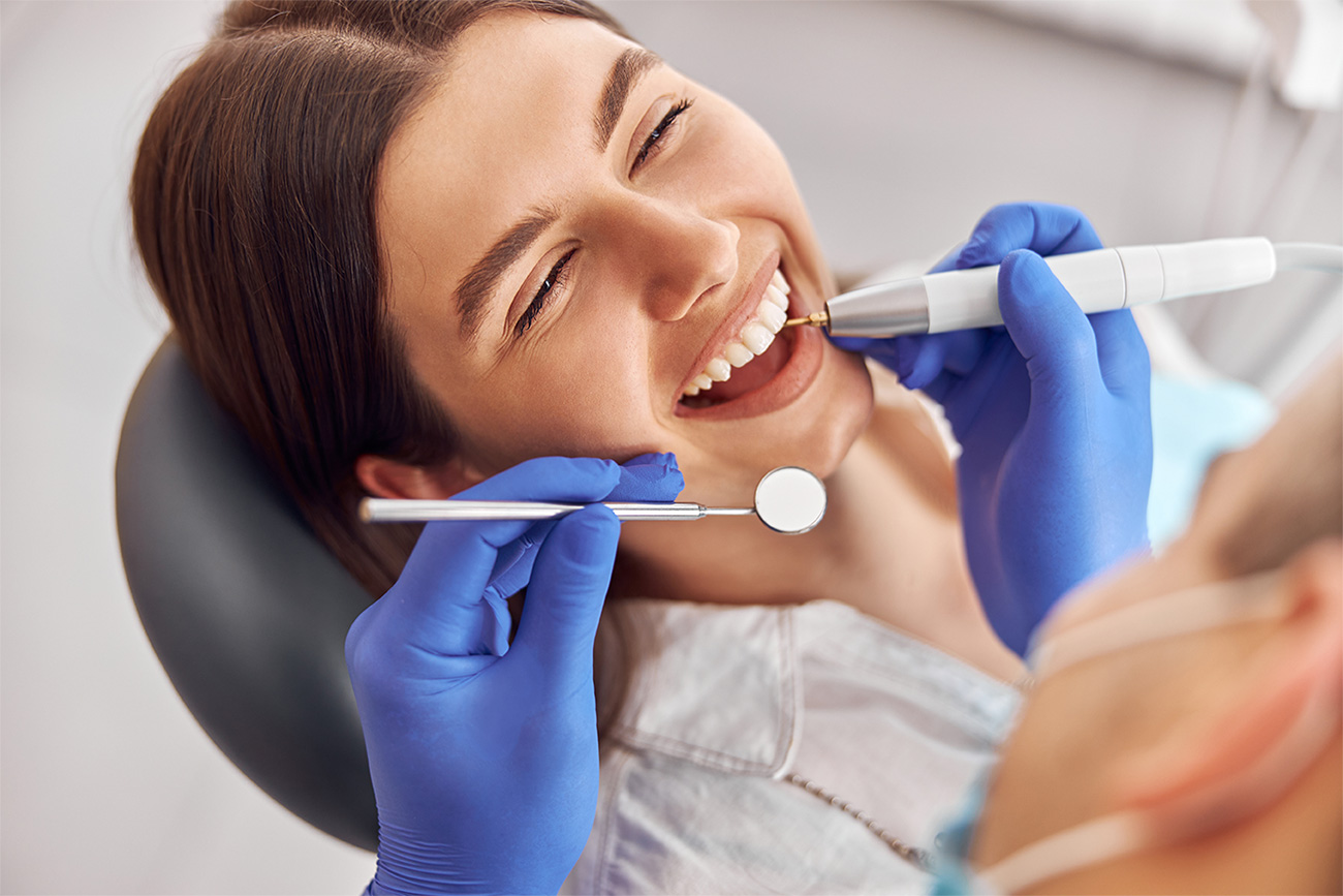 Patient receiving cosmetic dental polishing treatment
